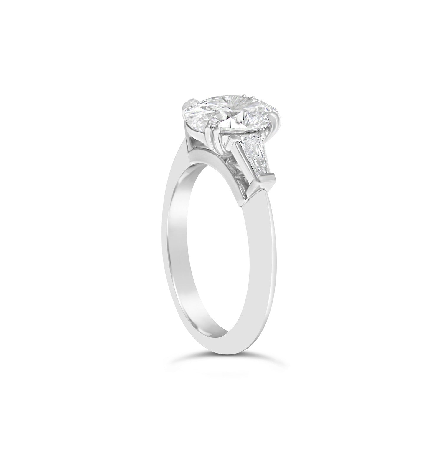 Oval Cut & Tapered Baguette Cut Diamond Three Stone Engagement Ring with plain band 