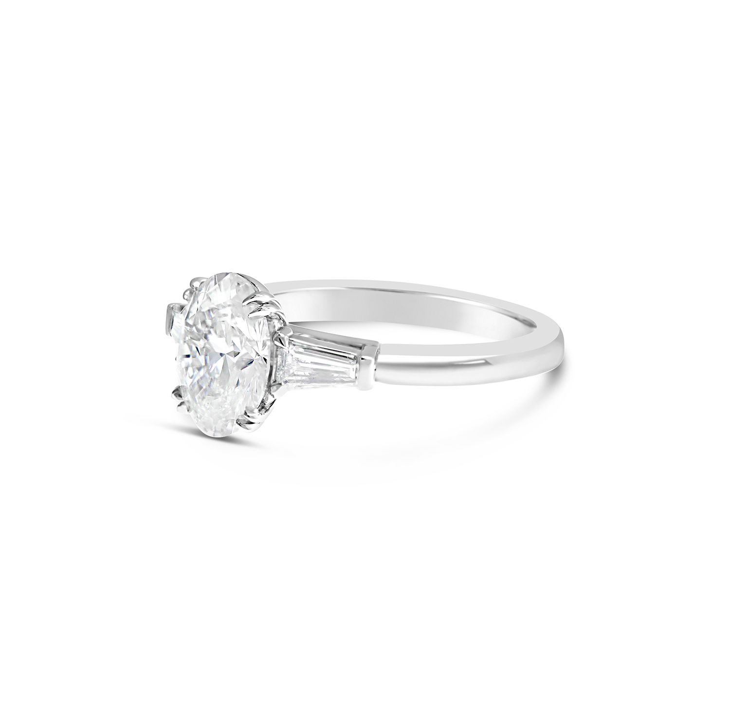 Oval Cut & Tapered Baguette Cut Diamond Three Stone Engagement Ring with plain band 